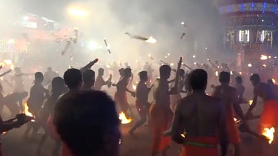 Devotees hurled fire at each other as part of a fire ritual 'Thoothedhara' or ‘Agni Kheli’ at Sri Durgaparameshwari temple in Kateel, Karnataka. (ANI)