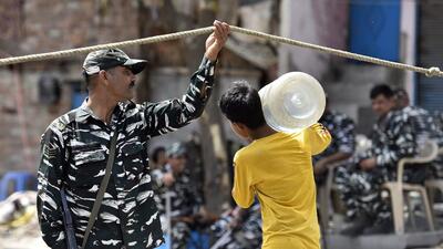 Residents of Delhi's Jahangirpuri area, who had a hard time commuting to work, as well as accessing clean drinking water and other necessities, on Saturday morning headed out for work, even as other vendors were allowed to enter the block. (Sanjeev Verma/HT) Residents of Delhi's Jahangirpuri area, who had a hard time commuting to work, as well as accessing clean drinking water and other necessities, on Saturday morning headed out for work, even as other vendors were allowed to enter the block. (Sanjeev Verma/HT)