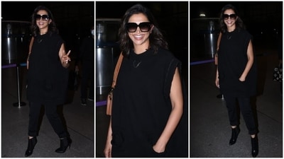 Deepika Padukone aces the airport look in a black oversized hoodie, denim and ankle length boots.&nbsp; (HT Photo/Varinder Chawla)