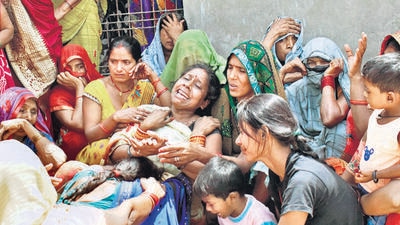 Relatives of the deceased mourn, at Khevrajpur village, near Prayagraj on Saturday. (ANI) Relatives of the deceased mourn, at Khevrajpur village, near Prayagraj on Saturday. (ANI)