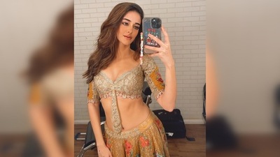 Ananya Panday teamed the gorgeous lehenga with a dazzling ivory blouse featuring a plunging neckline and colourful patchwork on the sleeves. (Instagram/@ananyapanday) Ananya Panday teamed the gorgeous lehenga with a dazzling ivory blouse featuring a plunging neckline and colourful patchwork on the sleeves. (Instagram/@ananyapanday)