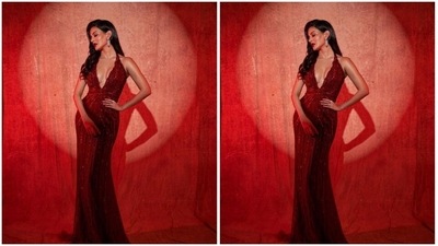The midriff-baring sleeveless gown came with intricate silver and maroon resham threads. In statement silver earrings form the house of Dolsun Jewels, she accessorised her look. (Instagram/@amyradastur93)