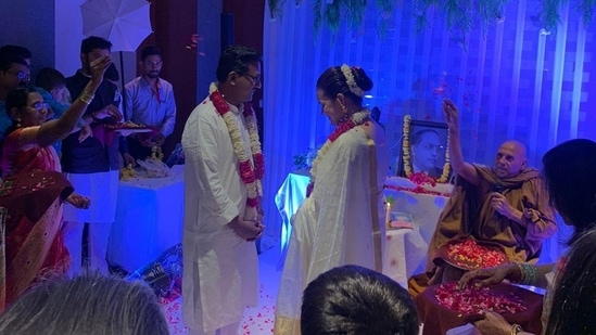 In a picture shared by Vinod Jakhar, the secretary of the National Students' Union of India, Tina Dabi and Dr Pradeep Gawande can be seen exchanging garlands with a portrait of Dalit icon BR Ambedkar in the background.(Twitter/@VinodJakharIN)