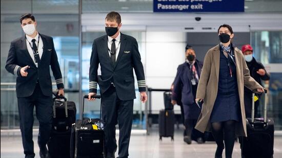 Airline staff at Montreal-Pierre Elliott Trudeau International Airport (YUL) in Montreal, Quebec, Canada, on Friday. (Bloomberg)