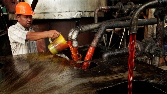 A worker checks the quality of crude palm oil (CPO) in a state CPO processing unit at Indonesia's North Sumatra province May, 2012. REUTERS/Tarmizy Harva(REUTERS)