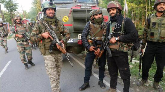 Paramilitary personnel deployed at a site where an encounter took place between security forces and JeM terrorists, at the Mirhama area, in Jammu and Kashmir’s Kulgam district on Saturday. (ANI)