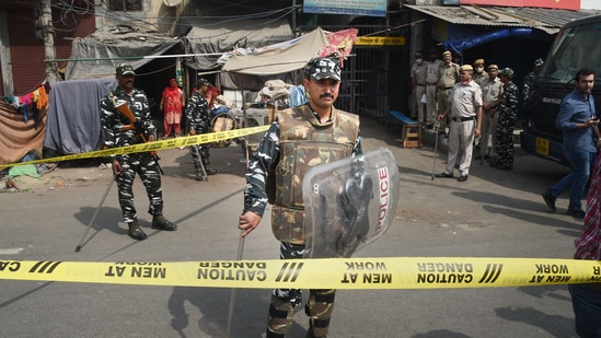 Security personnel keep vigil after clashes broke out between two communities during a Hanuman Jayanti procession on Saturday, at Jahangirpuri in New Delhi. (PTI Photo/Shahbaz Khan)(PTI)