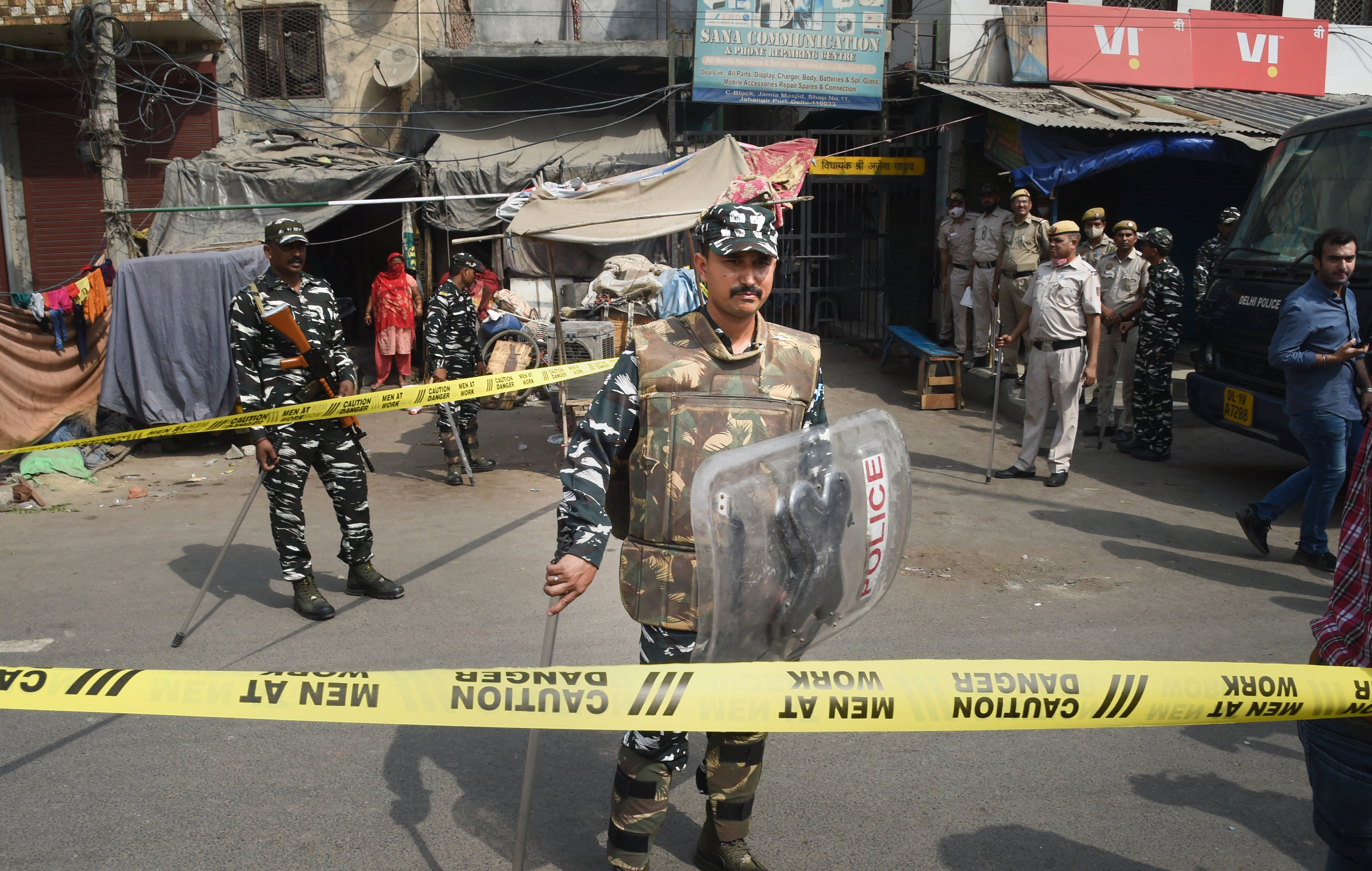 Security personnel keep vigil after clashes broke out between two communities during a Hanuman Jayanti procession on Saturday, at Jahangirpuri in New Delhi. (PTI Photo/Shahbaz Khan)(PTI)