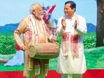 New Delhi: Prime Minister Narendra Modi with Union Minister Sarbananda Sonowal during a Bihu function.(PTI) New Delhi: Prime Minister Narendra Modi with Union Minister Sarbananda Sonowal during a Bihu function.(PTI)
