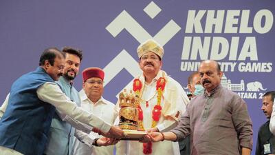 Vice president M Venkaiah Naidu receives a memento from Union minister Anurag Singh Thakur in the presence of Karnataka governor Thawarchand Gehlot, chief minister Basavaraj Bommai and during the opening ceremony of Khelo India University Games 2021, at the Kanteerava Indoor Stadium in Bengaluru. (AFP) Vice president M Venkaiah Naidu receives a memento from Union minister Anurag Singh Thakur in the presence of Karnataka governor Thawarchand Gehlot, chief minister Basavaraj Bommai and during the opening ceremony of Khelo India University Games 2021, at the Kanteerava Indoor Stadium in Bengaluru. (AFP)