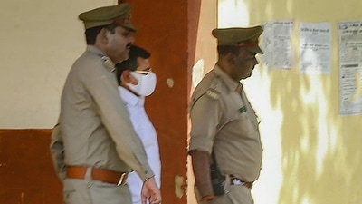 Ashish Mishra, accused in the Lakhimpur Kheri violence case, being taken to custody after he surrendered following Supreme Court's orders, in Lakhimpur Kheri district on Sunday. (PTI) Ashish Mishra, accused in the Lakhimpur Kheri violence case, being taken to custody after he surrendered following Supreme Court's orders, in Lakhimpur Kheri district on Sunday. (PTI)