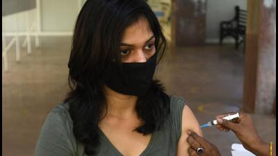 A woman receives a booster shot at a hospital in Noida on Sunday. (Sunil Ghosh/ HT) A woman receives a booster shot at a hospital in Noida on Sunday. (Sunil Ghosh/ HT)