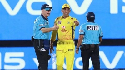 MS Dhoni walks on the field to confront umpires (BCCI)