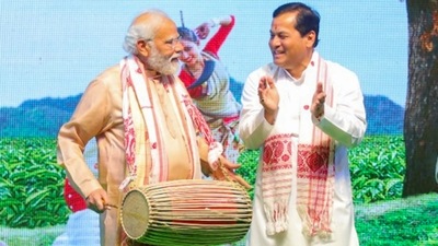 New Delhi: Prime Minister Narendra Modi with Union Minister Sarbananda Sonowal during a Bihu function. (PTI) New Delhi: Prime Minister Narendra Modi with Union Minister Sarbananda Sonowal during a Bihu function. (PTI)
