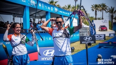 Recurve mixed team of Tarundeep Rai and Ridhi Phor celebrate after their triumph. (Twitter/worldarchery)