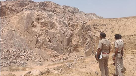 Cops at Dadam mining site in Bhiwani on Sunday. (HT Photo)