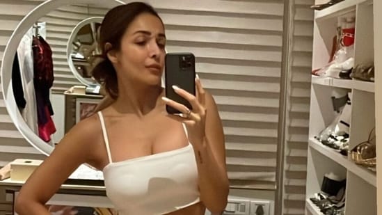 Malaika Arora in crop top and thigh-slit skirt gives glimpse of summer essentials with closet selfie: See inside