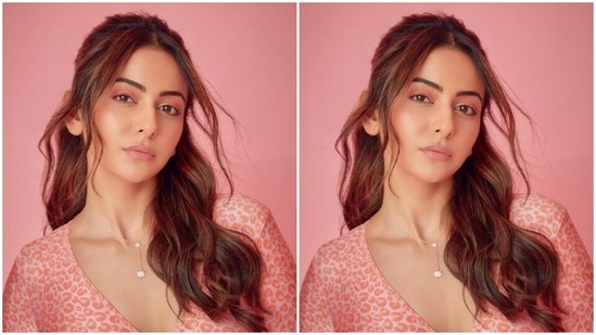 Rakul Preet paired a pink animal printed full-sleeved bodysuit with a pair of pink high-waisted trousers with wide legs.(Instagram/@rakulpreet)