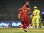 Mayank Agarwal hugs Rishi Dhawan after the wicket of MS Dhoni falls in the last over the match. (PTI)