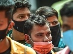 Passengers wearing face masks stand in a queue for Covid-19 test at Krantiveer Sangoli Rayanna railway station in Bengaluru (PTI)