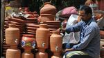 A potter arranging earthen pots at his road side shop in Maloya village, Chandigarh. (Ravi Kumar/ HT)