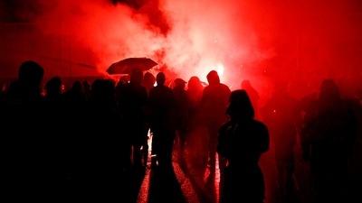 People attend a demonstration after the announcement of results of the 2022 French presidential election in Lyon, France. (REUTERS)