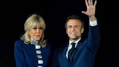 Emmanuel Macron, France's president, right, and wife Brigitte Macron celebrate on stage. Centrist Macron won around 58.6 percent of the vote in the second-round run-off compared with Le Pen's 41.4 percent, according to official results from the Interior Ministry. (Bloomberg) Emmanuel Macron, France's president, right, and wife Brigitte Macron celebrate on stage. Centrist Macron won around 58.6 percent of the vote in the second-round run-off compared with Le Pen's 41.4 percent, according to official results from the Interior Ministry. (Bloomberg)