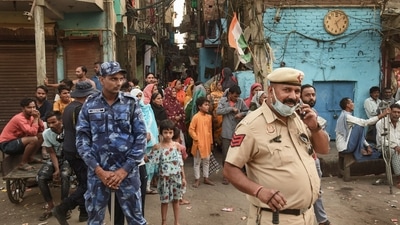 “Today, flower petals were showered from the same place that witnessed stone pelting on the day of the clashes. There was a sense of fear among the people after the April 16 violence. We requested the police to allow us to carry out the Tiranga Yatra so that a message of unity can be sent among the people and the atmosphere of terror can be eliminated,” Indramani Tiwari, the president of the Residents’ Welfare Association said. (PTI) “Today, flower petals were showered from the same place that witnessed stone pelting on the day of the clashes. There was a sense of fear among the people after the April 16 violence. We requested the police to allow us to carry out the Tiranga Yatra so that a message of unity can be sent among the people and the atmosphere of terror can be eliminated,” Indramani Tiwari, the president of the Residents’ Welfare Association said. (PTI)