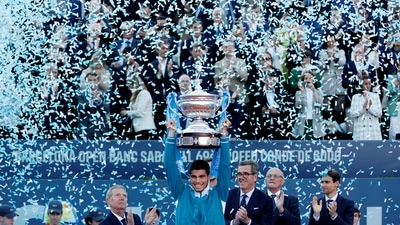 Spain's Carlos Alcaraz Garfia celebrates with the trophy after winning the final match against Pablo Carreno Busta (REUTERS)