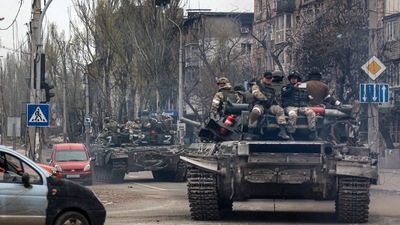 Russian tanks roll along a street in an area controlled by Russian-backed separatist forces in Mariupol, Ukraine. (AP) Russian tanks roll along a street in an area controlled by Russian-backed separatist forces in Mariupol, Ukraine. (AP)