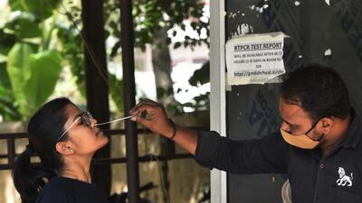 A health worker collects swab sample of a woman for Covid-19 testing, in Gurugram on Monday. (Vipin Kumar/HT PHOTO) A health worker collects swab sample of a woman for Covid-19 testing, in Gurugram on Monday. (Vipin Kumar/HT PHOTO)