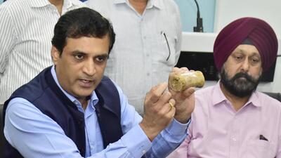 The Customs officials showing the wooden logs in which the heroin recovered at the Attari border in Amritsar was concealed. (HT File Photo) The Customs officials showing the wooden logs in which the heroin recovered at the Attari border in Amritsar was concealed. (HT File Photo)