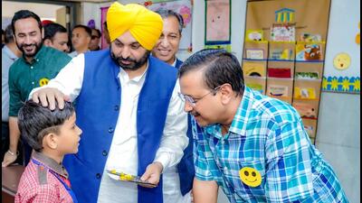 Punjab CM Bhagwant Mann and his Delhi counterpart and AAP chief Arvind Kejriwal during their visit to Dr BR Ambedkar Schools of Specialised Excellence at Kalkaji in New Delhi on Monday. (PTI)