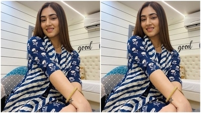 The Bade Achhe Lagte Hain 2 actor's suit set features a matching kurti and pants decorated with floral patterns in a white hue. The top features a round neckline, three-fourth sleeves and a breezy silhouette. Disha rounded off the ensemble with a blue and white striped printed dupatta draped on her neck. (Instagram/@dishaparmar) The Bade Achhe Lagte Hain 2 actor's suit set features a matching kurti and pants decorated with floral patterns in a white hue. The top features a round neckline, three-fourth sleeves and a breezy silhouette. Disha rounded off the ensemble with a blue and white striped printed dupatta draped on her neck. (Instagram/@dishaparmar)