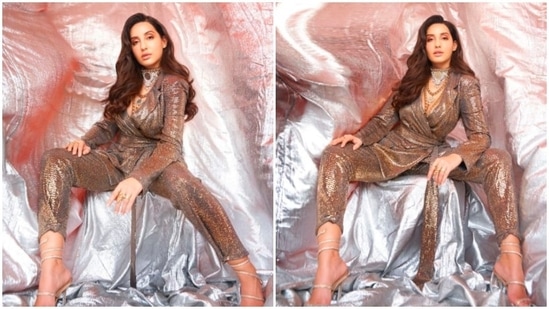 From fancy red carpet gowns to traditional attire, Nora Fatehi sure knows how to ace every look. Earlier, the Canadian beauty made jaws drop as she posed in a shimmery co-ord set.(Instagram/@manekaharisinghani)