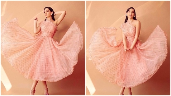 To the launch event of Dance Deewane Junior, Nora Fatehi donned a pretty pink one-shoulder organza dress by the designer duo Gauri & Nainika.(Instagram/@norafatehi)