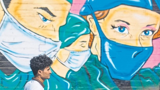 Those who are forced to use a mask because of a mandate often wear it in ways which are unlikely to protect - loosely, under the nose, on the chin, or with frequent touching of the mask (Pratik Chorge/HT PHOTO)