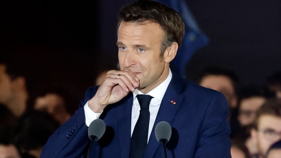 French President and La Republique en Marche (LREM) party candidate for re-election Emmanuel Macron, as he delivers his victory speech, at the Champ de Mars in Paris.(AFP)