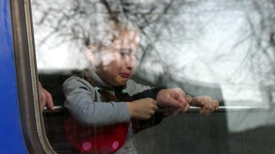 A child cries aboard a train as people travel to Przemysl, Poland, amid Russia's invasion of Ukraine, in Odesa, Ukraine.(REUTERS)
