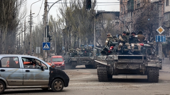Russian tanks roll along a street in an area controlled by Russian-backed separatist forces in Mariupol, Ukraine. (AP) Russian tanks roll along a street in an area controlled by Russian-backed separatist forces in Mariupol, Ukraine. (AP)