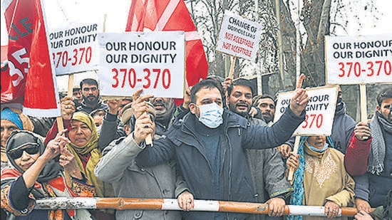 Srinagar, India - January 01, 2022: Activists of National Conference shout slogans and hold placards during a protest against the delimitation commission in Srinagar, Jammu and Kashmir, India on Saturday, January 1, 2022. People's Alliance for Gupkar Declaration (PAGD), an amalgam of Jammu and Kashmir's regional parties, had announced a sit in protest against recommendations of the commission. PAGD spokesperson said its leaders have been placed under house arrest ahead of today's protest. (Photo by Waseem Andrabi/Hindustan Times)