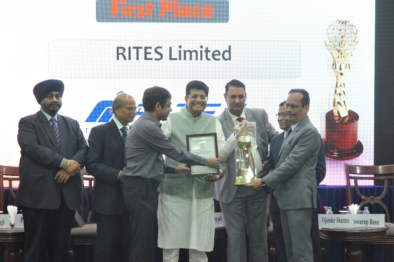 Union minister Piyush Goyal presents the trophy to RITES representatives in Delhi.
