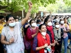 Members of the All India Institute of Medical Sciences (AIIMS) Nursing Union raise slogans as a part of an indefinite strike against the AIIMS administration. Members of the All India Institute of Medical Sciences (AIIMS) Nursing Union raise slogans as a part of an indefinite strike against the AIIMS administration. 