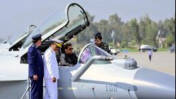 A Pakistan Air Force official briefs former prime minister Imran Khan (centre in cockpit) about Chinese-built J-10C fighter jet during a ceremony in Minhas Base near Islamabad, Pakistan, on March 11, 2022. (AP)