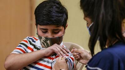 A healthcare worker administers a dose of the Corbevax vaccine to a child in the age group of 12-15 years in New Delhi. (HT PHOTO) A healthcare worker administers a dose of the Corbevax vaccine to a child in the age group of 12-15 years in New Delhi. (HT PHOTO)