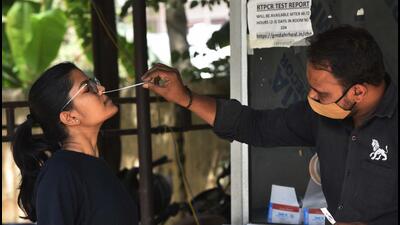 Gurugram, India – April 25, 2022: A health worker takes swab sample for Covid-19 test at an Urban Primary Health Center (UPHC), in Gurugram, India, on Monday, April 25, 2022. (Photo by Vipin Kumar/Hindustan Times) (Vipin Kumar/HT PHOTO) Gurugram, India – April 25, 2022: A health worker takes swab sample for Covid-19 test at an Urban Primary Health Center (UPHC), in Gurugram, India, on Monday, April 25, 2022. (Photo by Vipin Kumar/Hindustan Times) (Vipin Kumar/HT PHOTO)