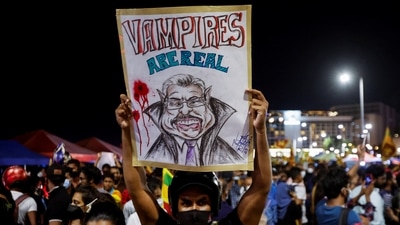 A demonstrator holding placard takes part in a protest against Sri Lanka President Gotabaya Rajapaksa, near the Presidential Secretariat, amid the country's economic crisis, in Colombo, Sri Lanka, Saturday. (REUTERS)