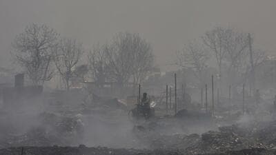 Gurugram, India - April. 26, 2022: Smoke billows from a site were a massive fire erupted in a garbage pile, near Kankrola village in Sector 6, Industrial Model Township (IMT) Manesar, in Gurugram, India, on Tuesday, April 26, 2022. One dead, three injured in the incident according to the reports. (Photo by Vipin Kumar/ Hindustan Times) (Vipin Kumar/HT PHOTO) Gurugram, India - April. 26, 2022: Smoke billows from a site were a massive fire erupted in a garbage pile, near Kankrola village in Sector 6, Industrial Model Township (IMT) Manesar, in Gurugram, India, on Tuesday, April 26, 2022. One dead, three injured in the incident according to the reports. (Photo by Vipin Kumar/ Hindustan Times) (Vipin Kumar/HT PHOTO)