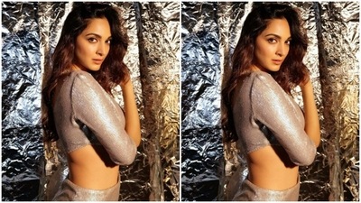 Kiara paired a silver cropped top with one off-shoulder and one full sleeve details with a high-waisted pencil long skirt with one thigh high slit. (Instagram/@kiaraaliaadvani)