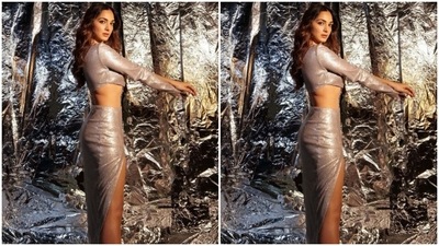 Kiara stretched her arms outwards and showed off her outfit as she posed for the pictures against a silver foil background. (Instagram/@kiaraaliaadvani)